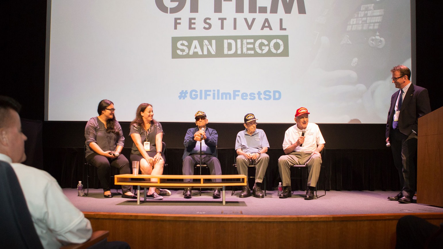 Panelists at the GI Film Festival San Diego Opening Night screening of "USS Indianapolis: The Legacy." From left to right: Melanie Capacia Johnson, Sara Vladic, Al Celaya (USS Indy Survivor), John Woolston (USS Indy Survivor), and Edgar Harrell (USS Indy Survivor), and panel moderator John Decker.